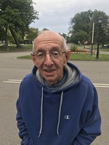 Ron Concilla and trees planted in memory of Don Nasca, Dennis Pines, and Dom Trapani.